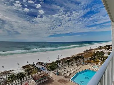 a view of the beach from the balcony of a resort at Summit Beach Resort #821 in Panama City Beach