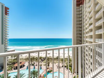a view of the beach from the balcony of a resort at Shores of Panama #1111 in Panama City Beach