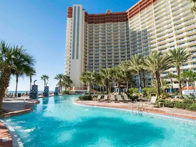 a swimming pool in front of a hotel at Shores of Panama #1111 in Panama City Beach