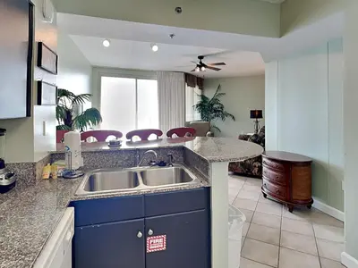 a kitchen with a sink and a counter top at Shores of Panama #1510 in Panama City Beach