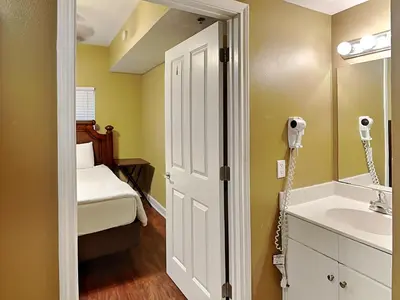 a bathroom with a sink and a mirror at Shores of Panama #1908 in Panama City Beach
