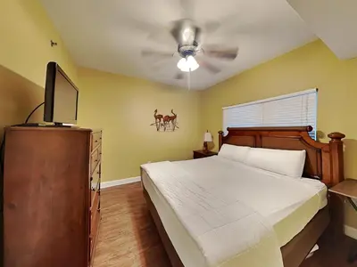 a bedroom with a bed and a ceiling fan at Shores of Panama #1908 in Panama City Beach