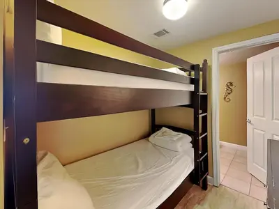 a bedroom with two bunk beds in a room at Shores of Panama #1908 in Panama City Beach