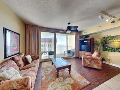 a living room with a couch and a table at Shores of Panama #1908 in Panama City Beach