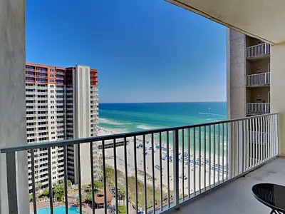 a balcony with a view of the beach and buildings at Shores of Panama #1706 in Panama City Beach