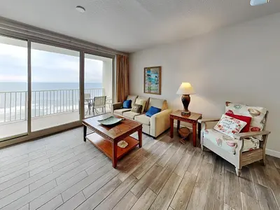 a living room with a view of the ocean at Shores of Panama #1611 in Panama City Beach