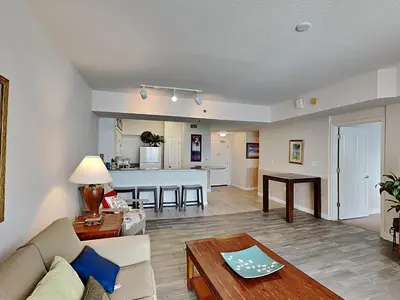 a living room with a couch and a table at Shores of Panama #1611 in Panama City Beach