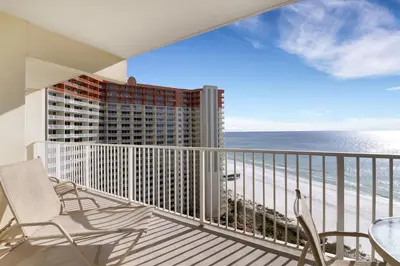 a balcony with chairs and a view of the ocean at Shores of Panama #1611 in Panama City Beach