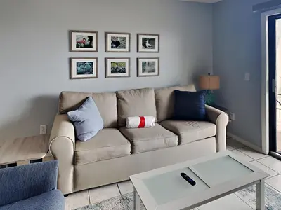 a living room with a couch and a table at Summit Beach Resort 330 in Panama City Beach