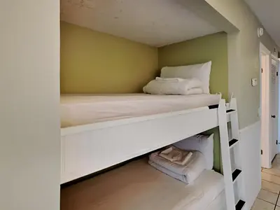 a bedroom with two bunk beds in a room at Summit Beach Resort 330 in Panama City Beach