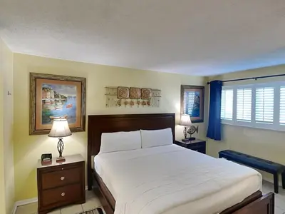 a bedroom with a large bed and a window at Summit Beach Resort #326 in Panama City Beach