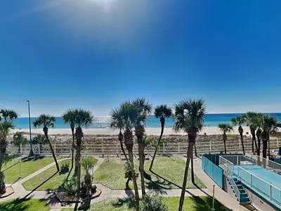 a view of the beach from the balcony of a resort at Summit Beach Resort #326 in Panama City Beach