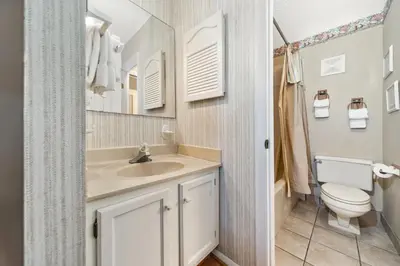 a bathroom with a sink and a toilet at Summit Beach Resort #429 in Panama City Beach