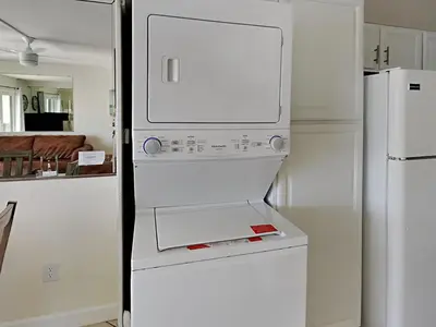 a white refrigerator with its door open in a kitchen at Summit Beach Resort 604 in Panama City Beach