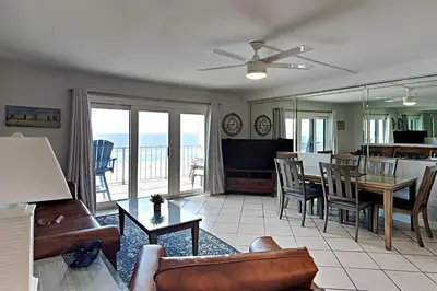 a living room with a couch and a table at Summit Beach Resort 604 in Panama City Beach
