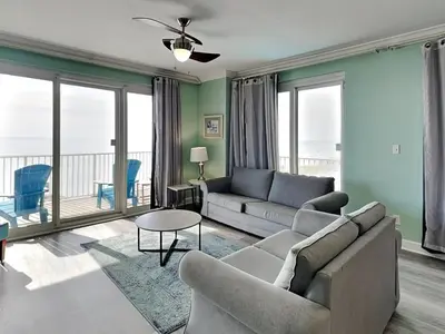 a living room with a couch and a table at Grandview East #104 in Panama City Beach