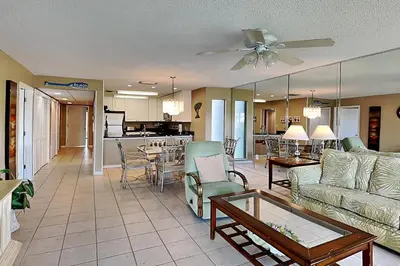 a living room with a couch and a table at Edgewater Villa 1307 in Panama City Beach