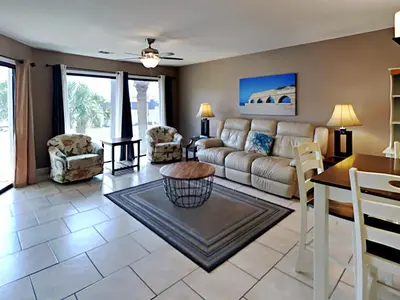 a living room with a couch and a table at Edgewater Villa 1312 in Panama City Beach