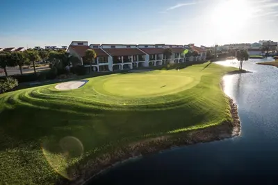 an aerial view of a golf course with a lake at Edgewater Villa 1410 in Panama City Beach