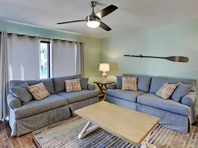 a living room with two couches and a coffee table at Edgewater Villa #2406 in Panama City Beach