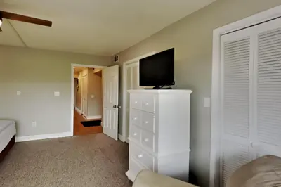 a bedroom with a tv on top of a dresser at Edgewater Villa #2301 in Panama City Beach
