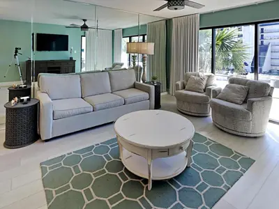 a living room with a couch and two chairs and a table at Edgewater Villa #3315 in Panama City Beach