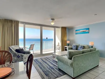 a living room with a couch and a table at Emerald Beach #1127 in Panama City Beach