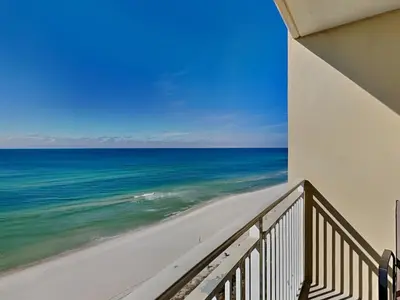 a balcony with a view of the ocean at Emerald Beach #1127 in Panama City Beach