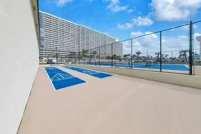 a view of a swimming pool with a building at Sunbird 1010E in Panama City Beach