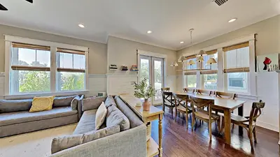 a living room with a couch and a table at The Den on 30A in Inlet Beach