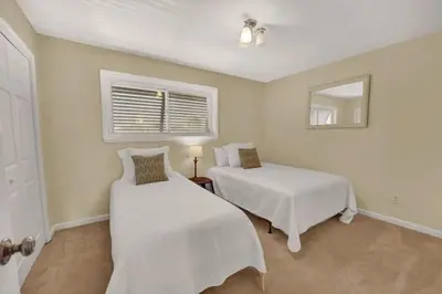 a bedroom with two beds and a window at Gulf-Front Seacrest Beach Condo w/ Private Access in Panama City Beach