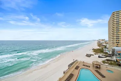 a view of the beach from the balcony of a resort at Quiet East End Gulf-Front Condo w/ Heated Pool & Balcony in Panama City Beach