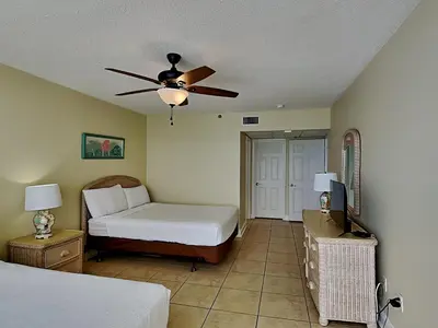 a bedroom with a bed and a ceiling fan at Long Beach Resort Tower II #904 in Panama City Beach