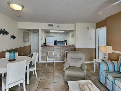 a living room with a couch and a table at Long Beach Resort Tower III #905 in Panama City Beach