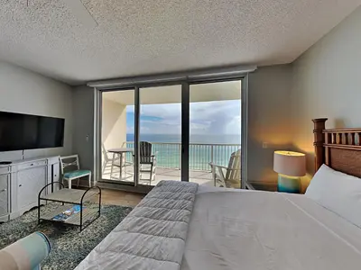 a bedroom with a bed and a view of the ocean at Majestic Beach Towers I #1109 in Panama City Beach