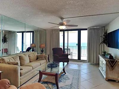 a living room with a couch and a table at Edgewater Tower II 509 in Panama City Beach