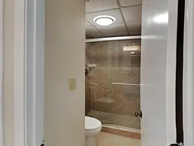 a bathroom with a toilet and a shower at Edgewater Tower II 509 in Panama City Beach