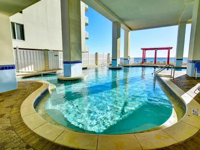 a large swimming pool in a building with a playground at Majestic Beach Towers I #1410 in Panama City Beach