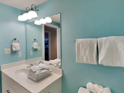 a bathroom with a sink and a mirror at Majestic Beach Towers II #1204 in Panama City Beach