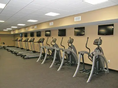 a row of exercise bikes lined up against a wall at Emerald Beach #1827 in Panama City Beach