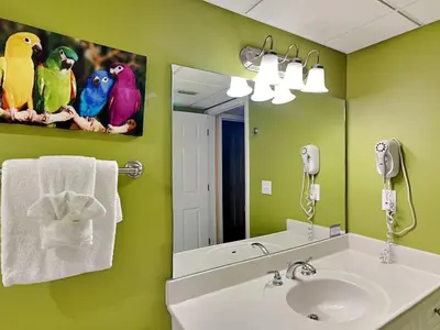 a bathroom with a sink and a mirror at Emerald Beach #1825 in Panama City Beach