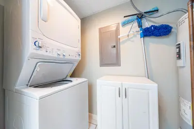 a laundry room with a washer and a dryer at Long Beach Resort Tower IV #407 in Panama City Beach