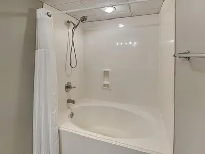 a bathroom with a shower with a bath tub at Long Beach Resort Tower I #503 in Panama City Beach