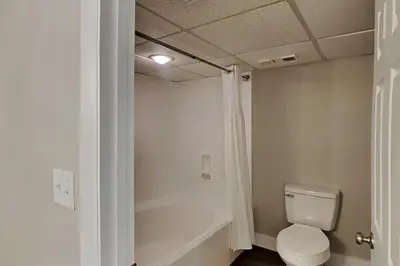 a bathroom with a toilet in a room at Long Beach Resort Tower II #503 in Panama City Beach