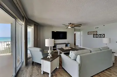 a living room with a couch and chairs and a television at Long Beach Resort Tower II #503 in Panama City Beach