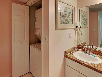 a bathroom with a sink and a mirror at Long Beach Resort Tower II #702 in Panama City Beach