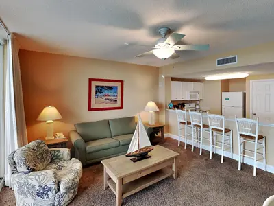 a living room with a couch and a table at Majestic Beach Towers I #2005 in Panama City Beach