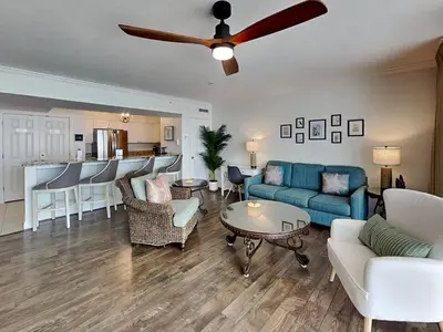 a living room with a couch and a table at Emerald Beach #1934 in Panama City Beach