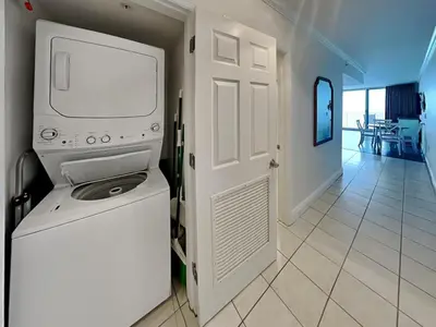 a white tv sitting on a stand in a room at Emerald Beach #1934 in Panama City Beach