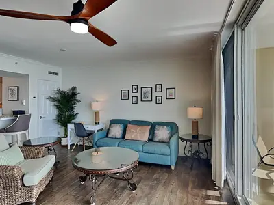 a living room with a couch and a table at Emerald Beach #1934 in Panama City Beach